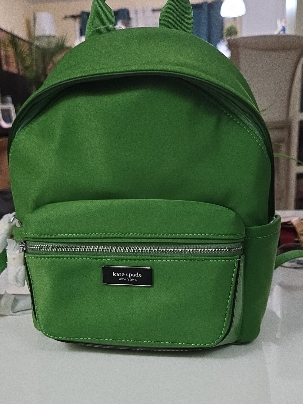 Kate Spade Sam Icon mini backpack with front zip pocket